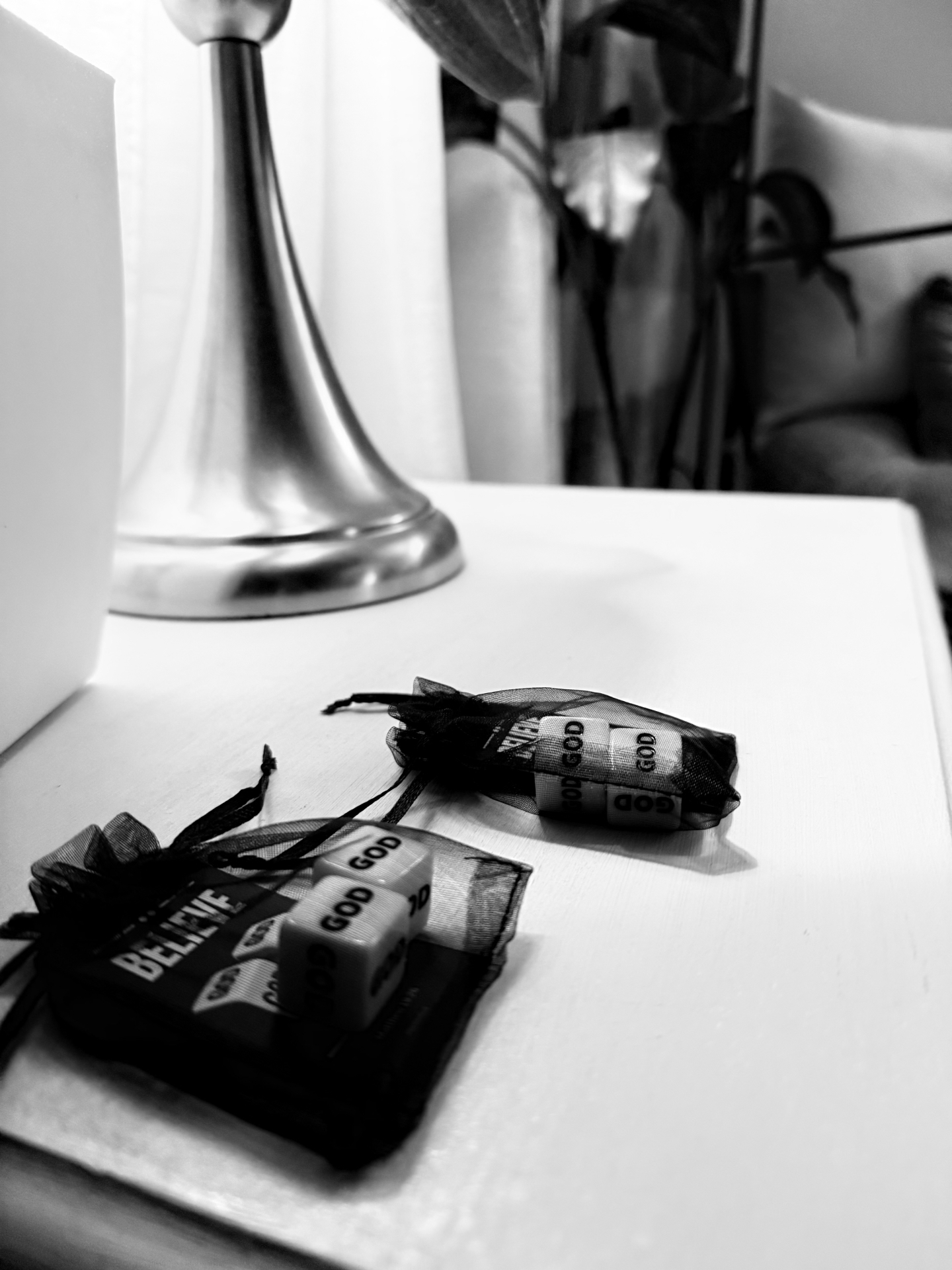 Believe — God dice on a nightstand