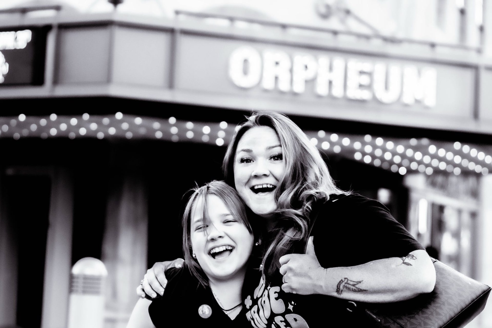 Mother and daughter laughing together
